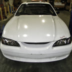 1994-1998 Ford Mustang SN95 1PC Crystal Headlights w/ Amber Reflectors (Matte Black Housing / Clear Lens)