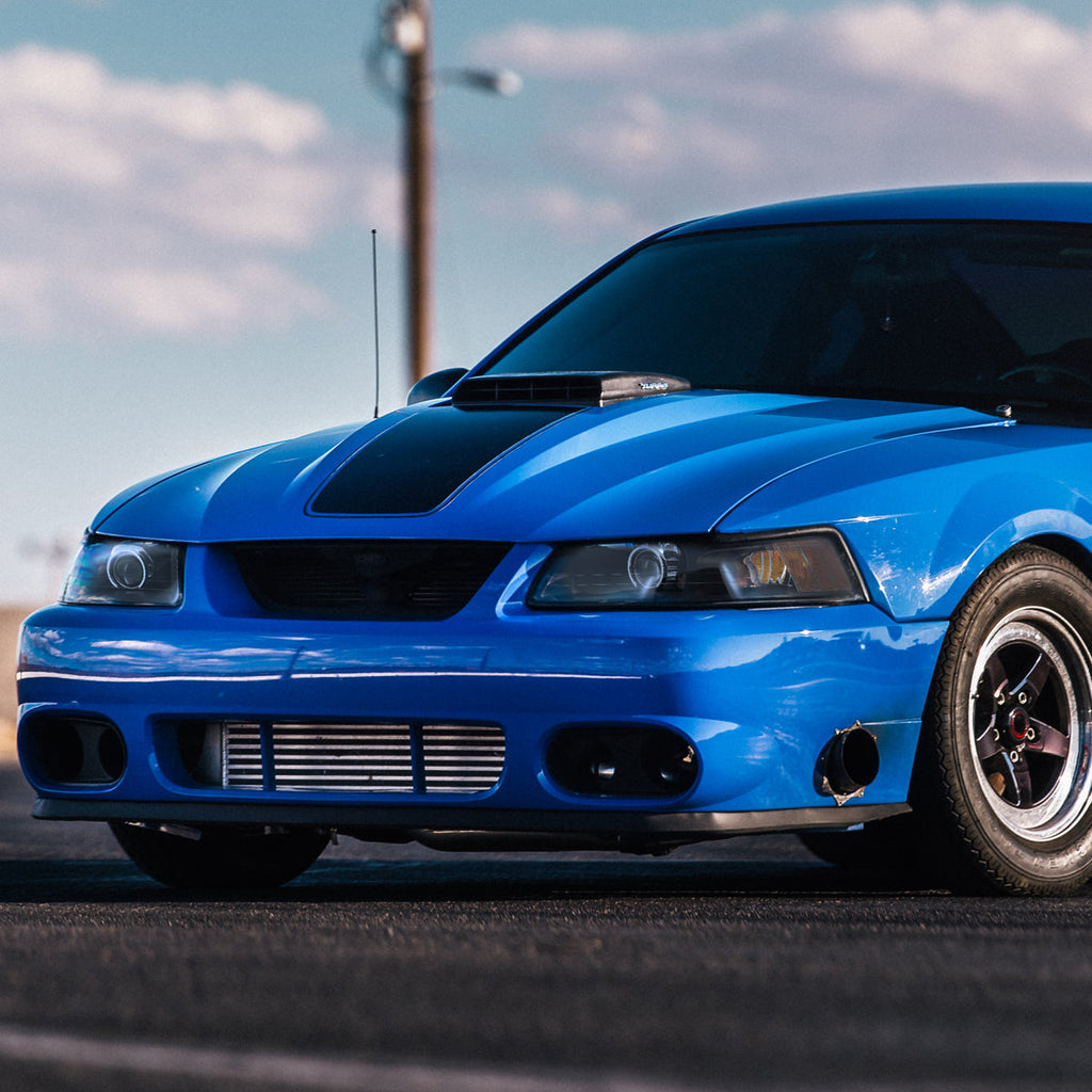1999-2004 Ford Mustang New Edge Projector Headlights w/ Amber Reflectors (Matte Black Housing / Clear Lens)