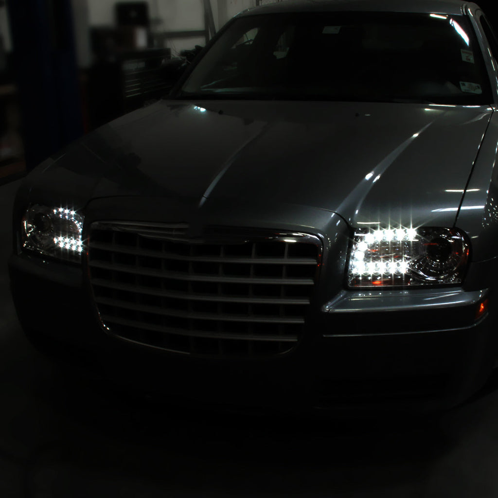 2005-2010 Chrysler 300 Base/LX/Touring Projector Headlights w/ LED Light Strip & LED Turn Signal Lights (Chrome Housing / Clear Lens)