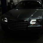 2005-2010 Chrysler 300 Base/LX/Touring Projector Headlights w/ LED Light Strip & LED Turn Signal Lights (Chrome Housing / Clear Lens)